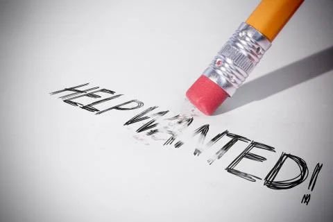 Pencil erasing the word Help wanted! Stock Photos
