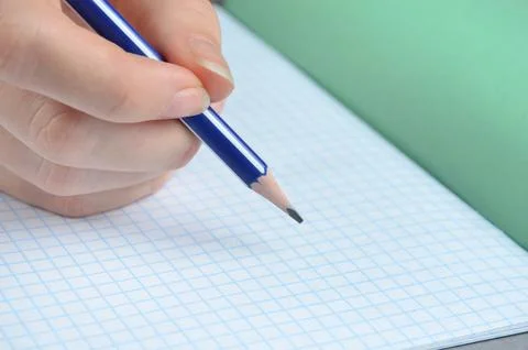 Pencil in hand. Blank notebook. Stock Photos