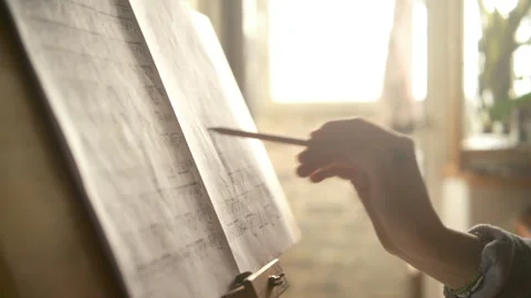 Pencil in hand making notes in music notes. home interior cinematic Stock Footage 312459046