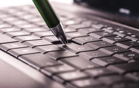 Pencil on keyboard Stock Photos