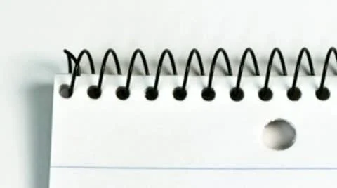 Pencil on a lined pad of paper Stock Footage 21304606