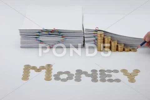 Pencil in man's hand with step of coins and document Stock Photos