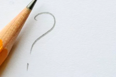 Pencil next to question mark on white paper Stock Photos