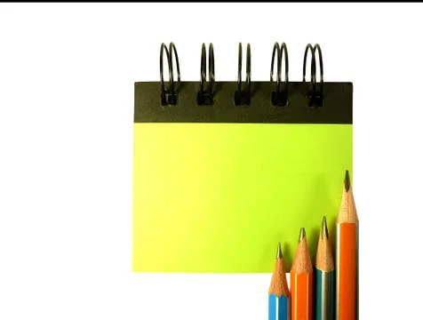 Pencil on notebook isolated on white background Stock Photos