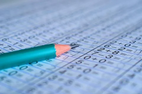 Pencil is on notebook with mathematical examples Stock Photos