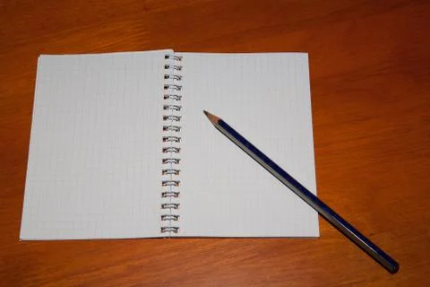 Pencil on a notebook Stock Photos