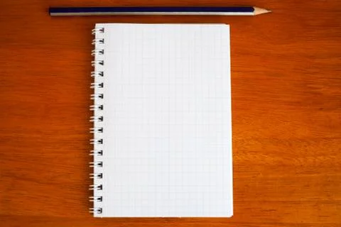 Pencil on a notebook Stock Photos