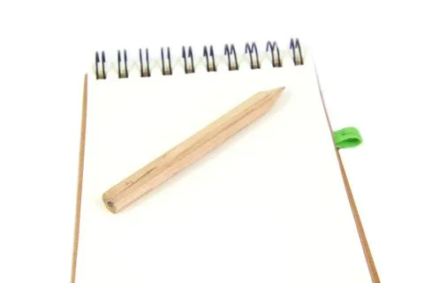 Pencil on notebook in white background Foto stock
