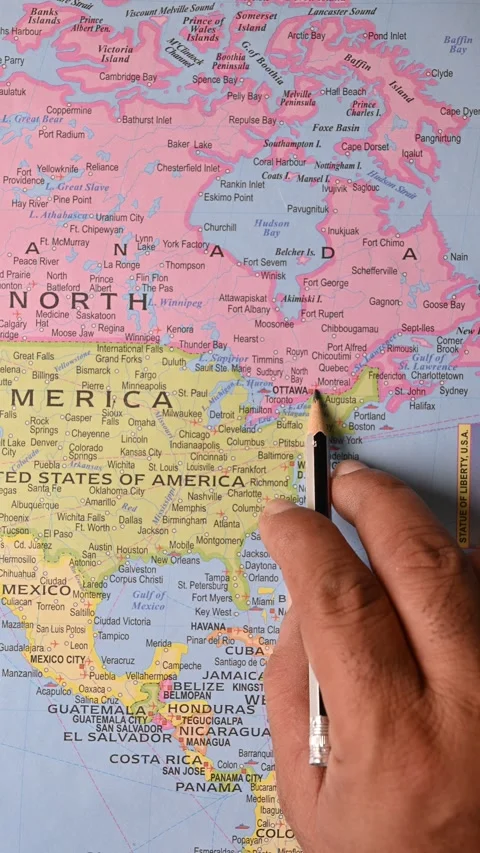 Pencil Pointing at Ottawa on World Map Top View Vertical Footage Stock Footage 329360599