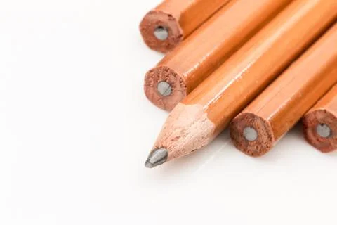 Pencil points, one sharpened on a white background. Stock Photos
