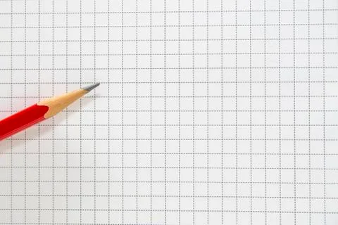 Pencil of red on the grid background Stock Photos