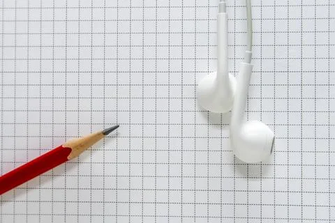 Pencil of red on the grid background Stock Photos