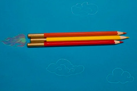 Pencil rocket in the clouds Stock Photos
