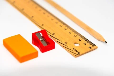 Pencil, ruler, eraser and sharpner isolated on white background. Stock Photos