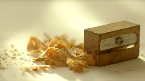 Pencil, Sharpener and Shavings on White Paper Stock Footage 60260808