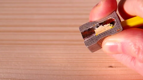 Pencil sharpener and a yellow pencil Stock Footage 34642903