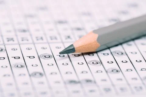 A pencil sitting on a test bubble sheet Stock Photos