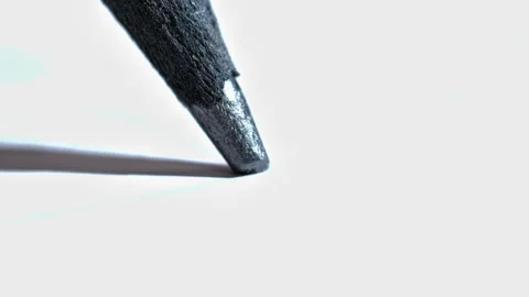 A pencil tip in motion, emphasizing the texture of the graphite and paper Stock Footage 321635652