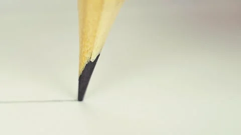 Pencil tip moving across clean white paper surface Stock Footage 322532040
