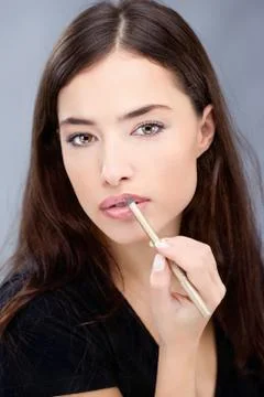 Pencil on woman's lips Stock Photos