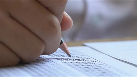 Pencil writing answer on paper answer of question in examination test. Stock Footage 104291024