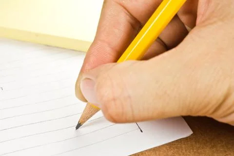 Pencil writing on note paper Stock Photos