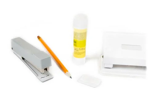 Pencils and sharpener with stapler and puncher Stock Photos