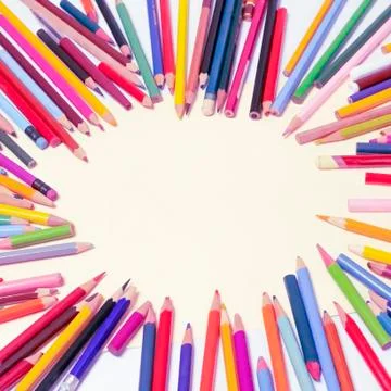Pencils are placed in circle in the form of a frame. Empty space in the center. Stock Photos