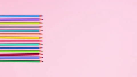 Pencils in different colors appear on left side. Stop motion Video stock 147500519