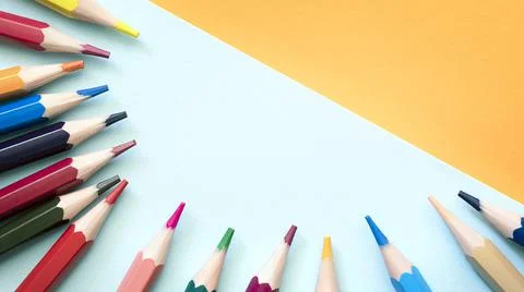 Pencils on empty sheet, blue and Orange tones Stock Photos