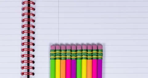 Pencils with eraser tips on notebook background Stock Photos