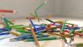 Pencils falling in slow motion on table HD Footage