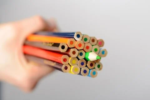 Pencils in hand Stock Photos