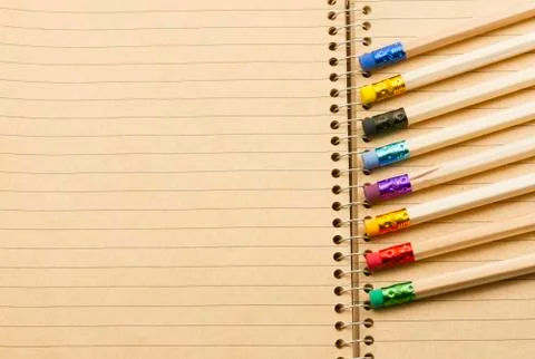 Pencils on notebook Stock Photos
