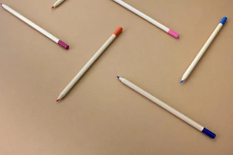 Pencils on a paper background, pattern Stock Photos