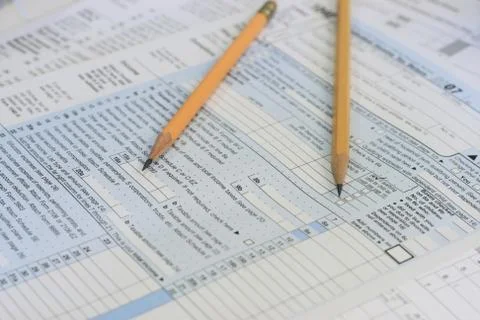 Pencils on tax forms Stock Photos