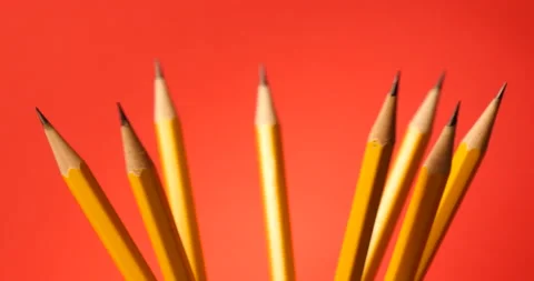 Pencils turning on a white red background 库存影片 162606091