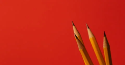 Pencils turning on a white red background 库存影片 162606469