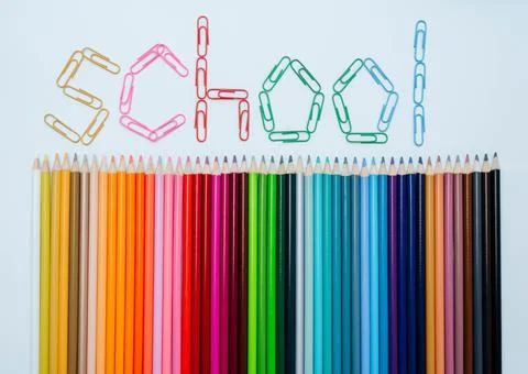 Pencils on a white with clips Stock Photos