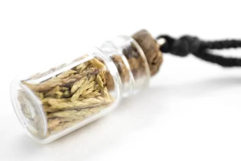 Pendant in the form of a small jar. Close up. Isolated on a white background 스톡 사진