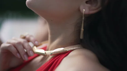 Pendant on a girl by the pool Stock Footage 169619502