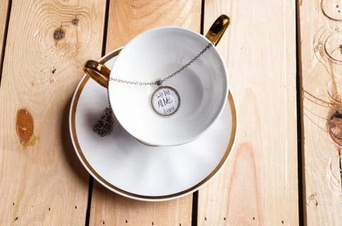 Pendant with the text on empty cup Stock Photos