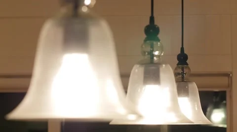 Pendent lights turning on and off Stock Footage 56668669