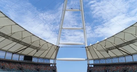 Pendulem swing off the top of Moses Mabhida Stadium Stock Footage 116275156