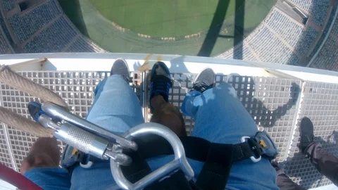 Pendulem swing off the top of Moses Mabhida Stadium Stock Footage 116275797
