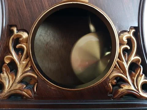 Pendulum clock ticking here and there close-up 스톡 사진