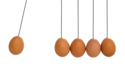 Pendulum with eggs Stock Photos
