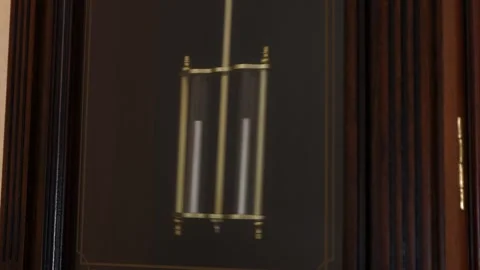Pendulum of modern wall clock swings close up Stock Footage 246197034