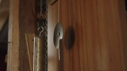 The pendulum of an old clock is swinging Stock Footage 328408060