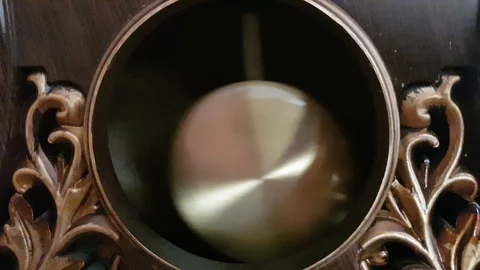 Pendulum of the old clock swings Stock Footage 112343132